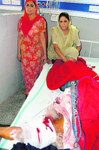 An injured Congress worker of Kaler village, Majitha segment, in a hospital in Amritsar on Monday.