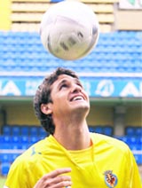 Villareal's new player Jose Edmlson Gomes de Moraes heads the ball during his official media presentation at the Madrigal Stadium in Villarreal