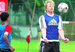 Former German Goalkeeper Oliver Kahn busy with the little footballers in Kolkata
