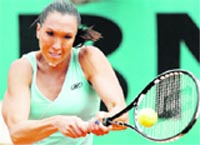 Serbias Jelena Jankovic returns the ball to Romanias Monica Niculescu at the French Open tennis tournament at Roland Garros stadium in Paris