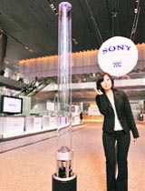 Japans electronics giant Sony unveils a new transparent pole speaker system Sountina, which renders stereo sound towards all directions, at the companys headquarters in Tokyo