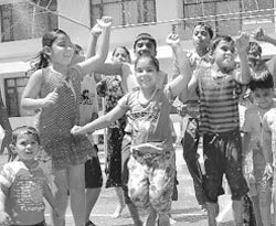 Students of Path Finder High School enjoy a rain dance party in Mohali