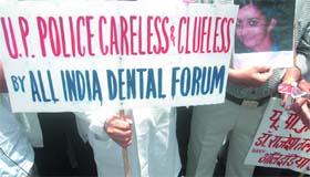 Dentists under the banner of the All-India Dental Forum protest against the improper police investigation and the arrest of Dr Rajesh Talwar in the Arushi murder case, at Jantar Mantar in New Delhi