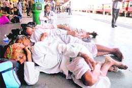 IN DEEP SLUMBER: Stranded passengers whose train was cancelled sleeping on a platform of the Jammu railway station on Wednesday.