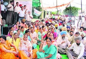 BSNL employees stage a dharna outside the telecom office near Bharat Nagar chowk in Ludhiana on Wednesday. 