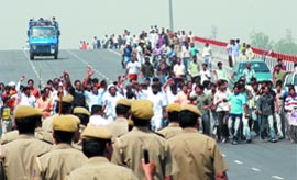 The agitators block the road at Delhi-UP border