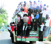 The improvised double-decker trucks continue to risk precious lives on the roads.