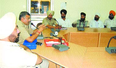 SP (city-I) S.K. Kalia addresses the representatives of religious places of the city at the Police Lines in Jalandhar on Thursday.