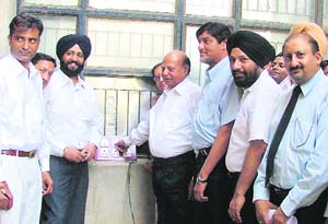 Sessions judge G.K. Rai inaugurates a submersible pump in the court complex in Ludhiana on Thursday. 