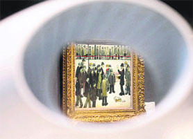 A painting entitled 'Manchester City vs. Sheffield United' 1938 by British artist Laurence Stephen Lowry is displayed at Christie's auction house in London on Friday. The painting is expected to fetch up to 1 million when is is auctioned on June 6 at the Christie's sale of 20th century British art during the British Art Week.