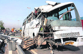 The mangled remains of a bus after an accident on the Expressway in Gurgaon on Friday. One person was killed and several others were injured.