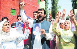 Senior Hurriyat leader Javed Mir protesting along with the family members of the missing boy in Srinagar