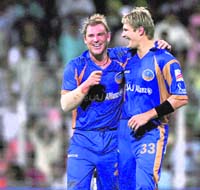 Rajasthan Royals captain Shane Warne greets Shane Watson on the dismisal of Farveez Maharoof during the IPL semifinal against Delhi Daredevils at the Wankhade Stadium in Mumbai on Friday. Watson was adjudged man of the match.