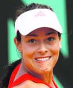 Serbias Ana Ivanovic eyes the ball as she plays Denmarks Caroline Wozniacki during their third round match of the French Open, at the Roland Garros stadium in Paris on Friday. Ivanovic won 6-4, 6-1.