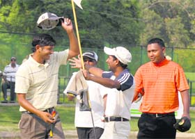 Harendra Gupta (left) is hugged by his caddie after winning the PGTI Players Championship at the Chandigarh Golf Club
