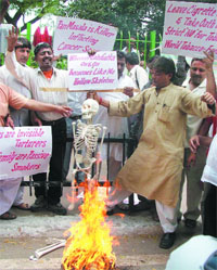 Activists under the banner of the National Human Rights Council protest against tobacco products on World No Tobacco Day in New Delhi on Saturday. 