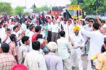 Gujjars stage a protest at the Jalandhar bypass by blocking the traffic in Ludhiana on Saturday.