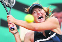 Maria Sharapova returns the ball to Italy's Karin Knapp at the Roland Garros stadium.