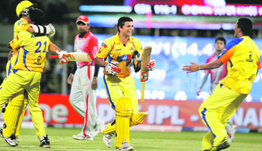 Chennai Super Kings team members celebrate their win over Punjab Kings XI to enter the finals of the IPL at the Wankhade Stadium in Mumbai on Saturday.