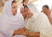 PPCC president Rajinder Kaur Bhattal (left) consoles the widow of Sham Lal