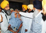 Mann consoles widow of Hargobind Singh in Ghasokhana village