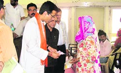 Power and public health minister Randeep Singh Surjewala hands over a cheque to a beneficiary under the Indira Gandhi Vivah Shagun Yojna in Kaithal