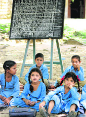 Due to lack of infrastructure, schoolchildren are forced to study in the open in Gundla village in Jammu.
