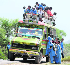 An overloaded mini-bus in the Dhansal division. People avail this service out of compulsion as there is no other transport facility available in the region. 