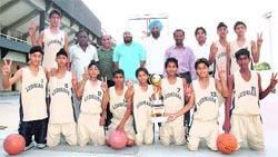 Players of the Ludhiana Basketball Academy, who emerged champions in the Sub-Junior Punjab State Basketball Championship held at Khanna, with office-bearers of the Ludhiana District Basketball Association at Guru Nanak Stadium, Ludhiana