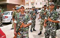 SSB jawans on guard outside the house of Talwars in Noida on Sunday.