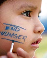 A girl has her face painted as she participates in the End hunger: Walk the world in Manila on Sunday.