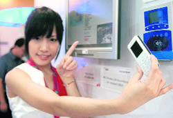 A model displays a cellphone at Asia's biggest computer show, also known as "Computex", in Taipei on Monday.