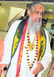 Controversial godman Chandraswami comes out of the UT State Guest House in Chandigarh on Monday.