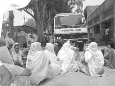Relatives of deceased Rajni Devi stage a dharna outside civil hospital to demand arrest of her in-laws in Kharar on Monday. A Tribune photograph