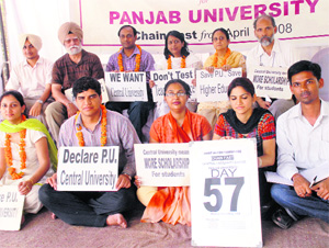 Teachers and students sit on chain hunger strike for the central university status at PU on Monday.