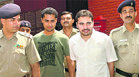 Harpreet Multani (second from right) and Vikram outside the Sector 4 police station on Monday.