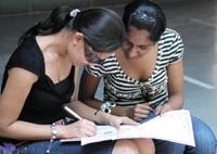 Students fill in the form at Kirorimal College on Monday.