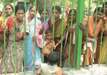 Anganwadi workers protest for regularisation of service and increase in wages at Jantar Mantar in New Delhi on Monday.