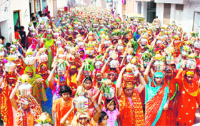 As many as 1,100 women take part in a kalash yatra organised on the occasion of murtisthapna at Shani Mandir in Gurgaon on Monday.
