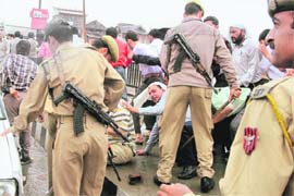The police lathicharges members of the Jammu, Kashmir and Ladakh All-departments Clerical Staff Association during a demonstration against the state government for ignoring their demands in Srinagar on Monday