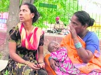 The mother of Anjali with the body of her child at a police station in Ludhiana on Monday