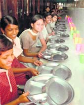 Unaware of the fact that food supplies of a large number of charitable institution have been affected, children of Bal Bhawan wait for the lunch in Ludhiana on Monday.