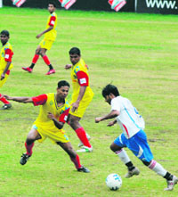 Goa and Railways players in action during the 62nd National Football Championship for the Santosh Trophy at Polo Ground in Srinagar on Monday.
