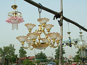 A vendor finds a novel way to display his chandeliers on the GT Road near Rama Mandi in Jalandhar.
