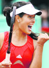 Serbias Ana Ivanovic celebrates after defeating Switzerlands Patty Schnyder during their quarterfinal match at the French Open at Roland Garros in Paris on Tuesday.