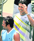 Leander Paes (L) and Mahesh Bhupathi have finally agreed to put their personal differences aside and team up for the Beijing Olympics.