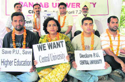 Teachers and students sit on the relay fast at Panjab University in Chandigarh on Wednesday.