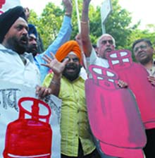 National Akali Dal activists protest against the UPA government for increasing the prices of petrol, diesel and LPG in New Delhi on Wednesday. 