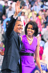 US Democratic presidential candidate Senator Barack Obama waves to the crowd with his wife Michelle at his side after delivering his speech at his South Dakota and Montana presidential primary election night rally at the Xcel Energy Center in St. Paul, Minnesota on Tuesday.