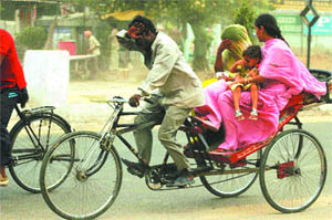 A dust storm catches commuters unawares in Jalandhar on Wednesday.